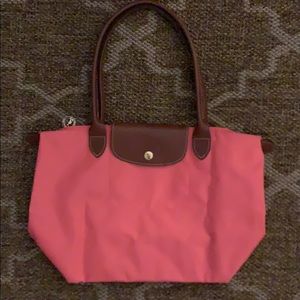 Peach colored long champ bag
